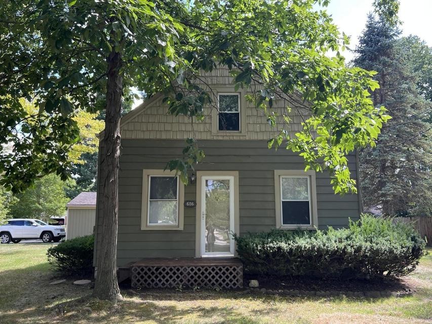 686 Troywood Drive Troy MI — front exterior of bungalow on a corner lot